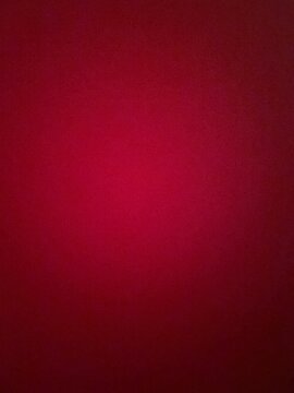 A vibrant red pixelated background with a circular gradient pattern