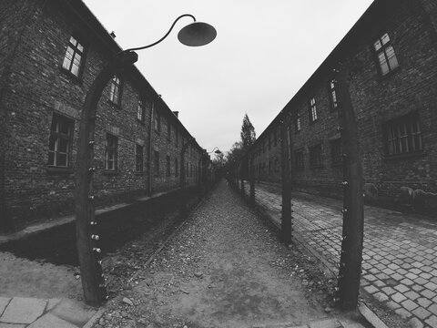 Oświęcim / Poland - April 27, 2019 - Electric fence with barbed wire in Auschwitz I German Nazi Concentration and Extermination Camp on the outskirts of Oswiecim, Poland. 