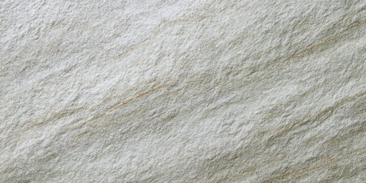 A close-up view of a rough, textured surface with faint parallel lines