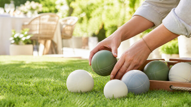 Lawn games setup on grass for backyard summer event, showing diverse hands