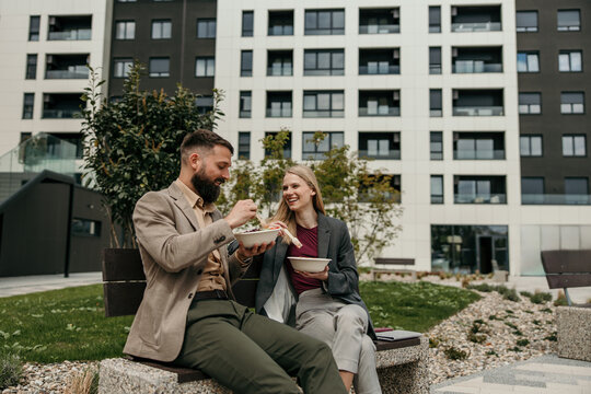 Business people having lunch break outdoors