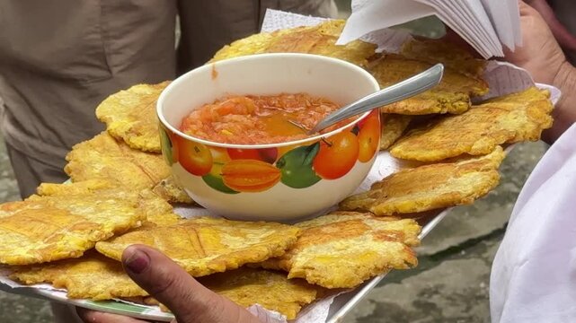 Colombian-Style Fried Plantains with Tomato-Onion Sauce (Patacones Con Hogao)