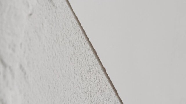 Vertical arc vertical shot of white half flattened half sifted powder surface