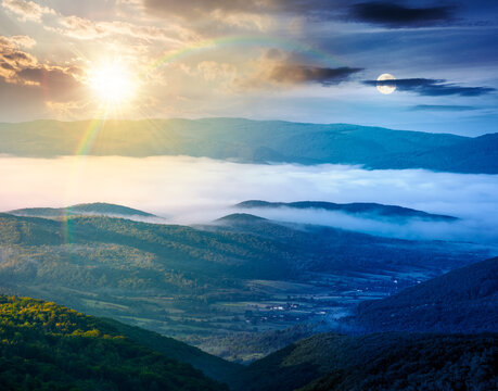 foggy carpathian mountain landscape. day meet night. outdoor adventure with stunning view. sun and moon in harmony over mountainous countryside of ukraine on summer solstice. rolling hills