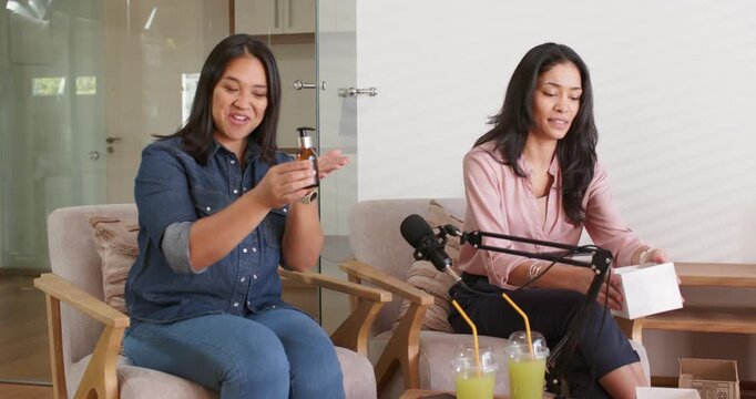 Diverse female hosts: left picking amber bottle, right opening box, tuning mic, preparing recording