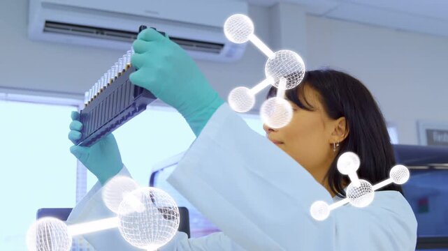 Lab tech picking multiwell plate, raising, checking wells for QC with molecules overlaying plate