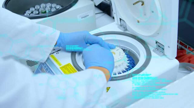 With lid open gloved hands lifting, rotating, aligning rotor insert and securing cap for sample run