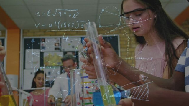 Student holding cylinder in lab, initiating data overlay for analysis while peers measuring liquids