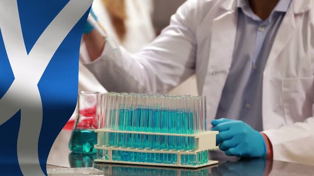 Lab tech lifting pipette pipetting blue solution into tubes for test, blue overlay obscuring frame