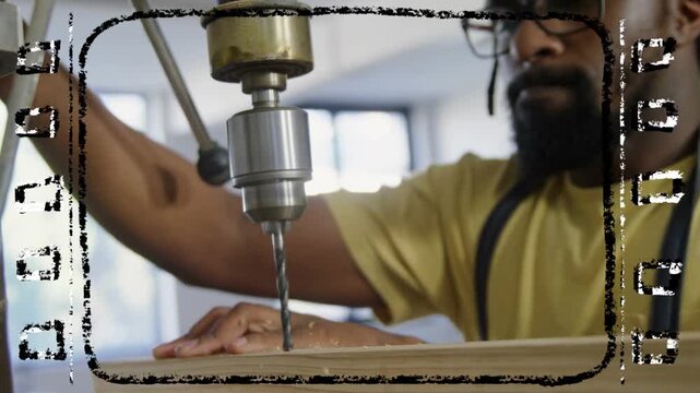 Maker pulling drill lever, drilling board while steadying hands, reaching depth, filmstrip border