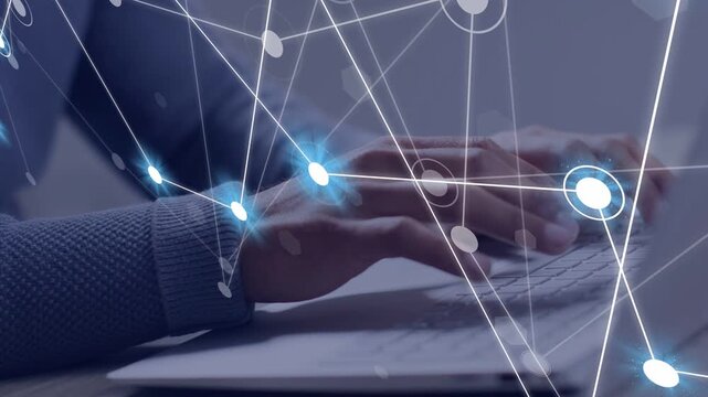 Man typing on laptop keyboard, initiating technology network overlay fading in and visualizing data