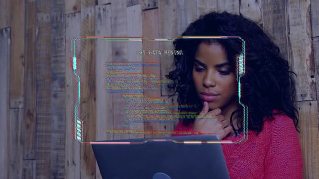 Woman looking down, causing translucent HUD with scrolling code appearing over laptop, analyzing