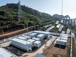 Fototapeta premium Energy storage power station and solar photovoltaic panels facility in the mountains
