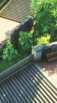 People walk along stone stairs in a park. Green plants grow along the steps. Lamp posts stand among the trees. Sunlight shines on the scene, highlighting the natural beauty.