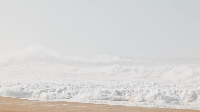 Big waves crushing in winter season in Nazare, Portugal