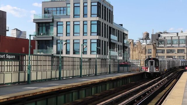 subway train arriving on elevated platform in queens new york city (nyc commuter metro) outdoor stop leaving riding departing ride commute urban raised car
