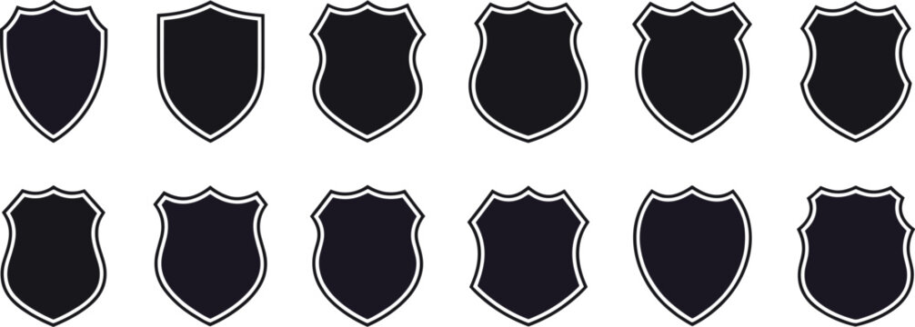 Twelve black shield shapes with white outlines in two rows on a dark background