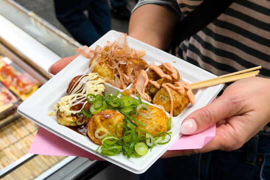 a plate of Japanese food Takoyaki