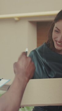 Recipient happily accepts parcel at building, Woman gratefully takes delivery as courier departs vehicle