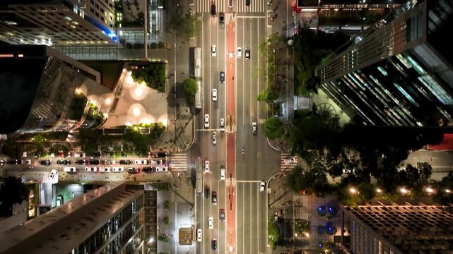 SAO PAULO, BRAZIL - MAY 2026: Top down aerial night view of traffic, cars and crosswalks on Paulista Avenue