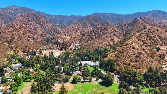 Green Brand Park at the foot of the Verdugo Mountains. View on the white mansion of Library and Art Center. Glendale, California, USA.