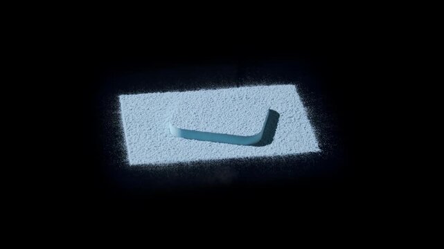 Vertical jib close-up of blue powder sifted into a larger rectangle around a smaller pedestal, lit by dynamic orbiting light casting vivid shadows on a black surface | Concept for eyeshadow marketing