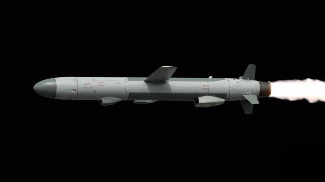 A matte gray cruise missile travels horizontally against a solid black background, featuring crisp technical markings and stabilizing fins. This clean, side-profile element is ideal for defense techno