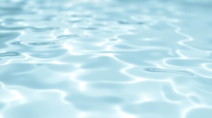 Fototapeta premium Calm water ripples on soft blue surface reflecting bright light in minimalist liquid scene.