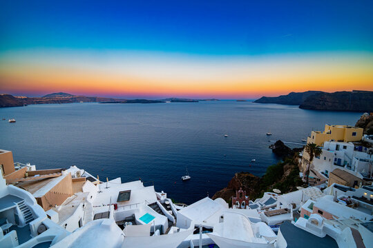 Panoramic Oia village sunset over the caldera