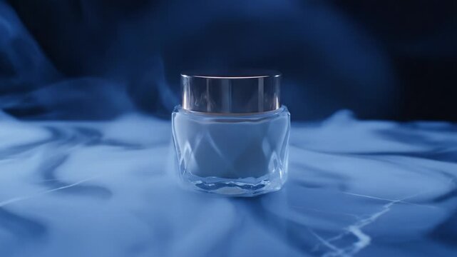 Glass face cream jar on marble with thick blue smoke swirling around it. The atmosphere is mysterious and luxurious. Ideal for advertising premium skincare products and luxury beauty brands.