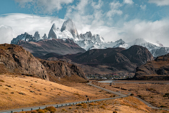 Mount Fitz Roy Over El Chalten with Runner on Scenic Road