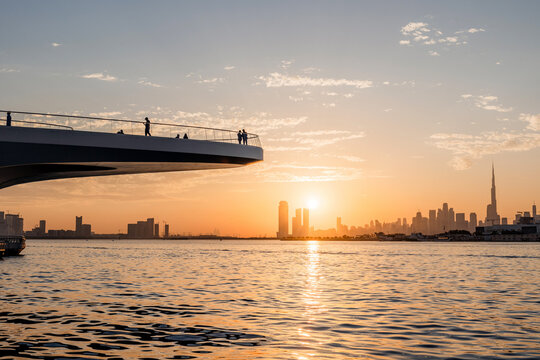 Dubai cityscape at sunset where modern ambition meets daily business life. Entrepreneurs meetings skyline and energy, Duba is drive for success shines every evening