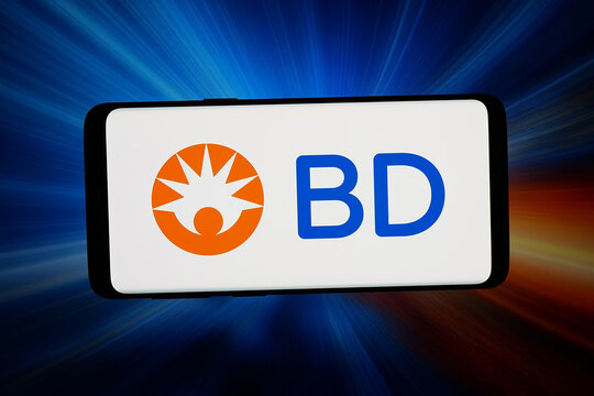 Stuttgart, Germany - 05-18-2026: In this photo illustration, the logo of business Becton, Dickinson and Company (BD) is displayed on a smartphone in front of abstract background on computer screen.