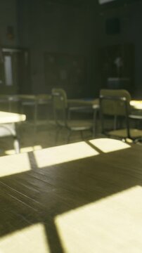 Sunlight streams into an empty classroom. Desks are arranged neatly. The atmosphere suggests it is late afternoon. No students are present in this space for learning.