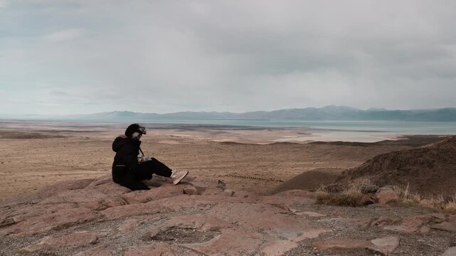 Woman Enjoying Panoramic View of Patagonian Landscape and Lake
