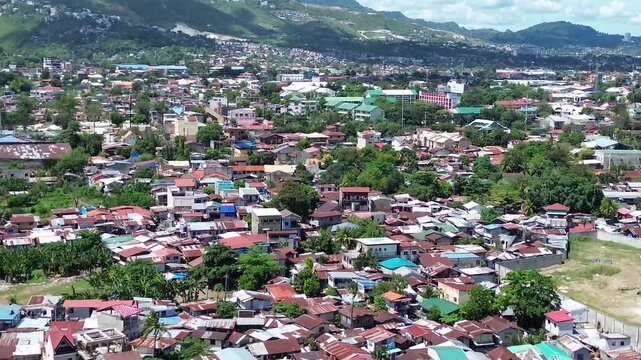 Aerial footage of urban residential environment and tightly packed buildings in Cebu City Philippines.