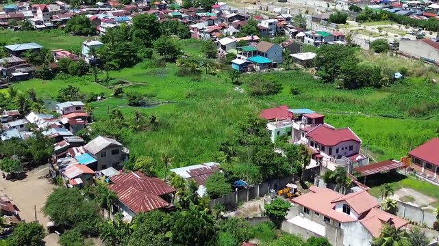 Aerial footage of urban residential environment and tightly packed buildings in Cebu City Philippines.