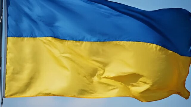 Ukrainian Flag Waving Proudly Against a Clear Blue Sky 2.