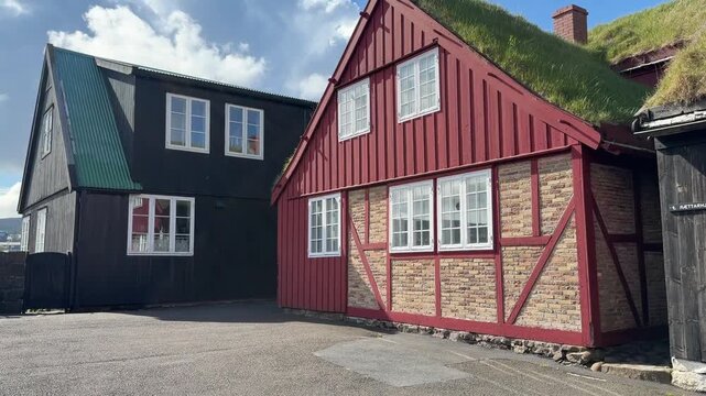 Traditional black wooden houses with turf roofs in the old town of Reyni, T&oacute;rshavn, Faroe Islands