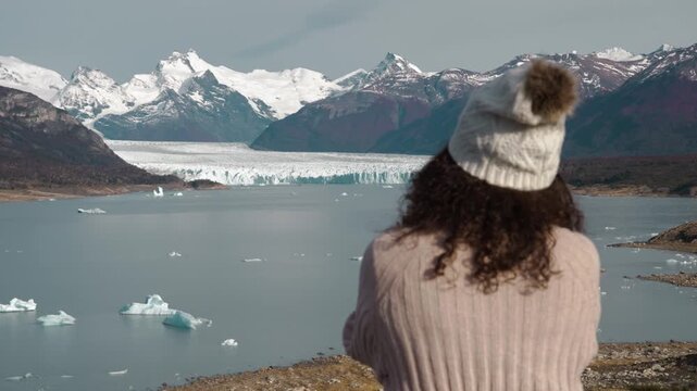 Female Traveler Photographing Perito Moreno Glacier in Patagonia