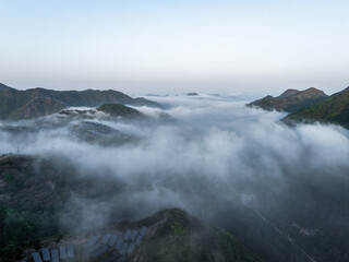Fototapeta premium Magnificent sunrise view over mountains with sea of clouds and misty landscape