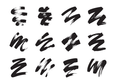 Black ink brush stroke set including curly lines zig zag shapes and artistic paint smear elements.