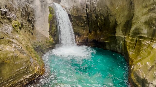 Scenic waterfall cascading through rocky Sapadere Canyon in Turkey surrounded by lush greenery