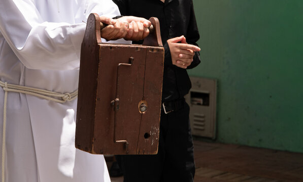 Traditional wooden clapper in Holy Week liturgy