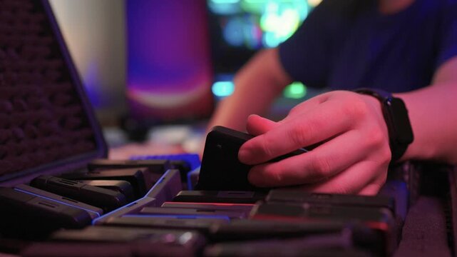 Precise sorting of multiple external storage devices in orderly rows. Systematic placement of various external hard discs emphasizing organization and cataloging principles
