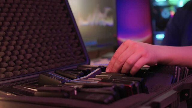 Precise sorting of multiple external storage devices in orderly rows. Systematic placement of various external hard discs emphasizing organization and cataloging principles