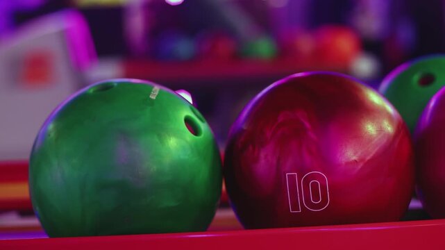 Bowling club play, group team of friends and colleagues playing, throwing a ball on the bowling alley lane, ball and pins, corporate party event in a mall amusement game center, tournament competition