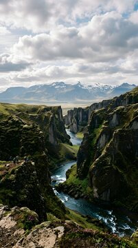 Dramatic fja&eth;r&aacute;rglj&uacute;fur canyon with river and mountains under cloudy sky landscape mountains geography outdoors adventure