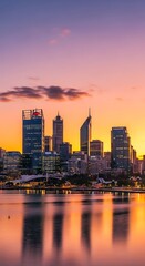 Fototapeta premium Modern City Skyline Reflecting on Calm Waterfront at Colorful Sunset