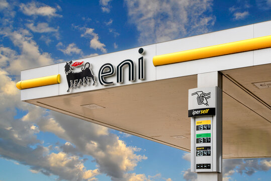 Italy - May 19, 2026: Eni gas station with fuel price display totem showing diesel and gasoline costs in Italy against blue cloudy sky. Concept of high fuel prices